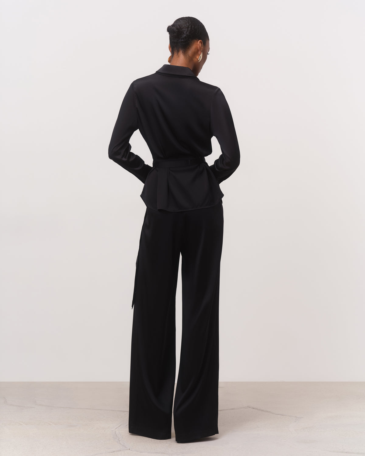 Black silk button-down shirt and palazzo trousers set, back view