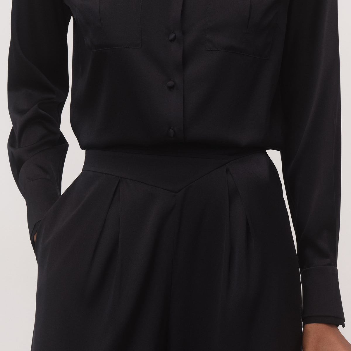 Women's black mulberry silk shirt and wide-leg trousers, full-length close up view