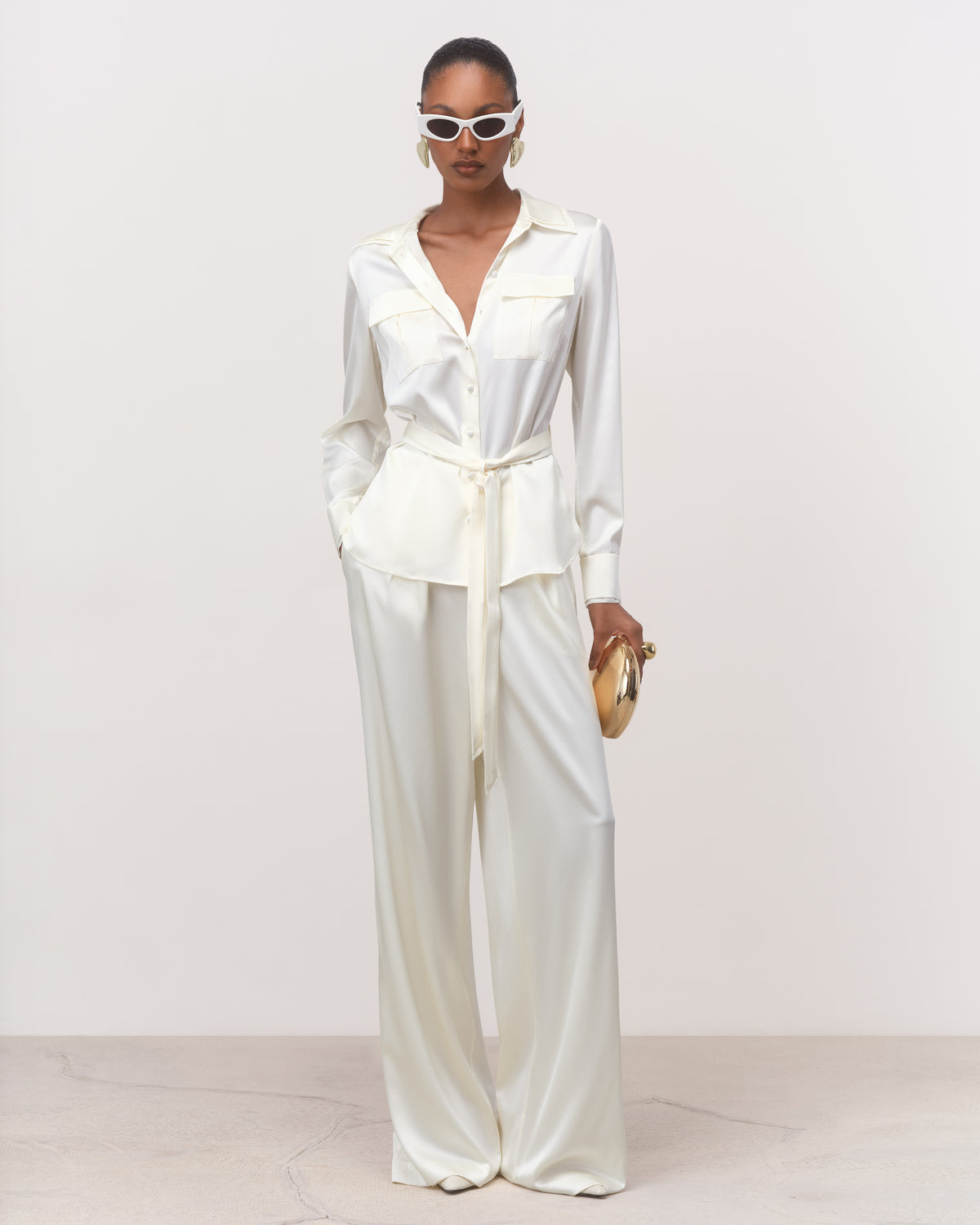 Pearl silk shirt with self-fabric belt styled with wide-leg trousers, front view