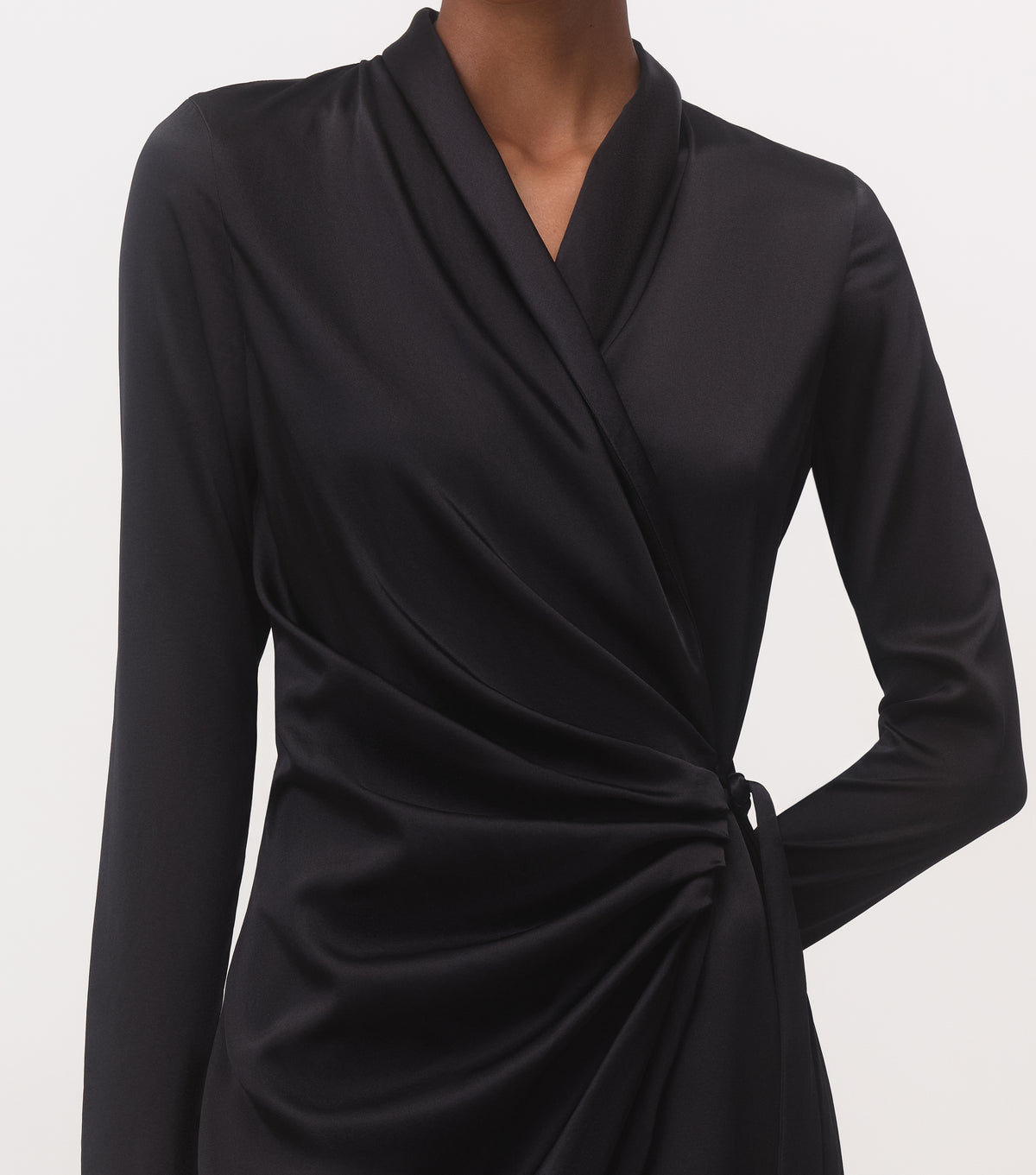 Close-up of black mulberry silk wrap midi dress with surplice V-neckline and long sleeve