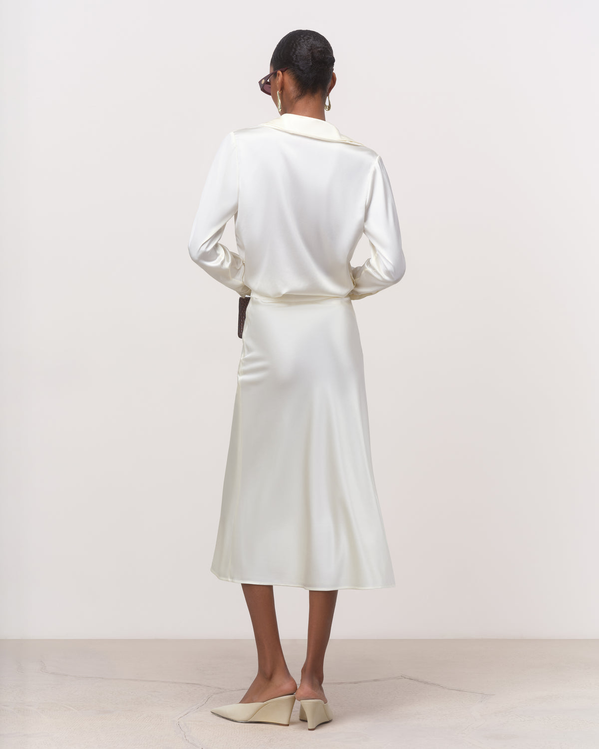Back view of white bias cut silk skirt with A-line hem