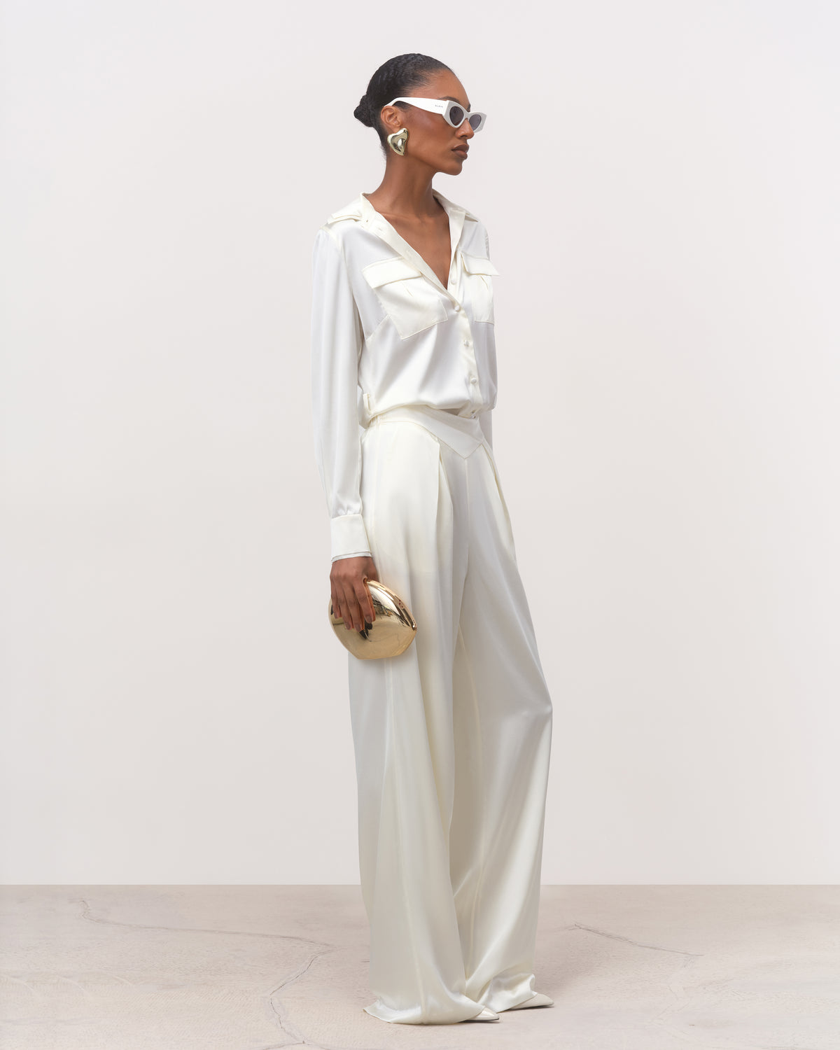 Women's white mulberry silk belted shirt with wide-leg silk trousers, three-quarter view